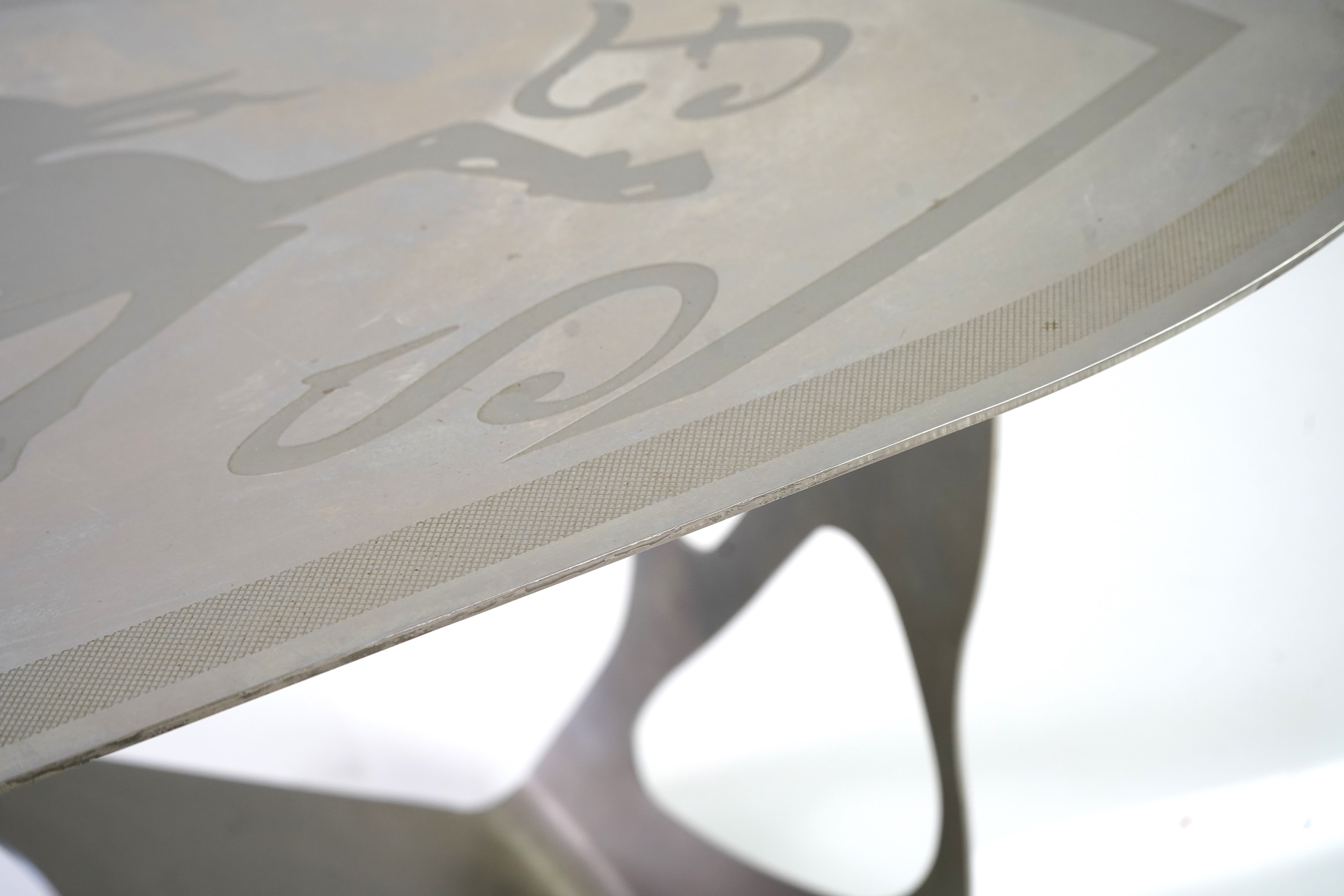 Pietro Psaier (Italian 1939-2004) A Ferrari polished steel coffee table, 1 of 3, in homage to Carlo Mollino